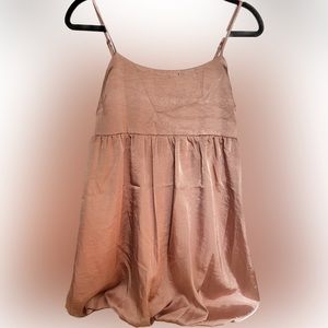Shining rose gold color dress with adjustable straps.